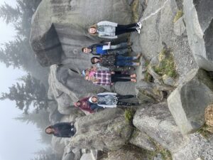 Children pose in a rock garden.