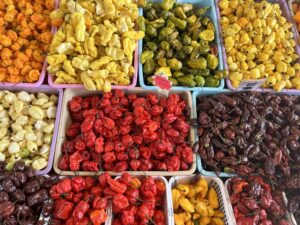 image of various pepper varieties in farmers market stand